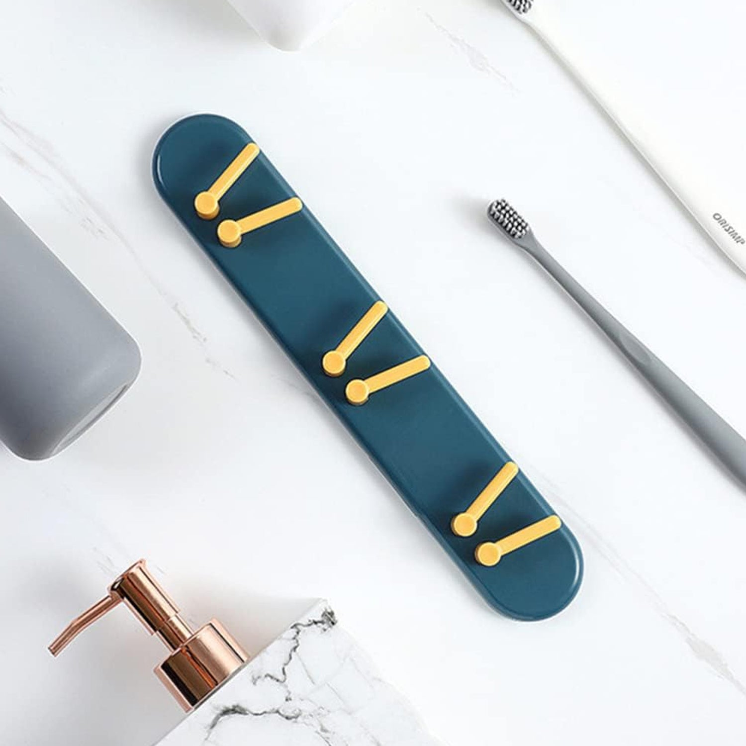 Wall-mounted toothbrush holder with shelves and hooks for bathroom organization. Wall-mounted toothbrush holder with shelves and hooks for bathroom organization.